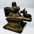 Indian brass Shaivite shrine featuring a Shiva Lingam, yoni-pitha, and recumbent Nandi bull, circa 19th century.