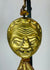 Himalayan gilt bronze ritual mask pendant with textile tassels