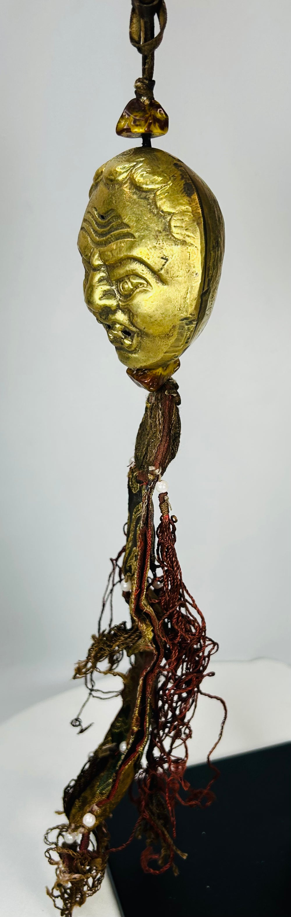 Tibetan Buddhist protective mask ornament with brocade textiles