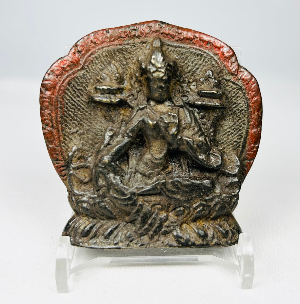Antique Tibetan Buddhist plaque with lotus-seated bodhisattva figure