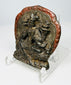 Tibetan cast bronze devotional pendant with seated Buddhist figure