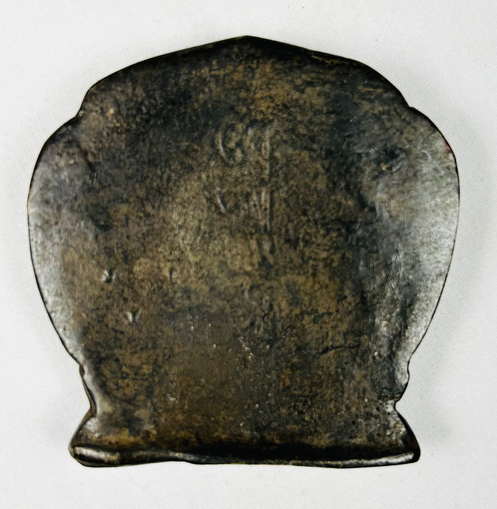 Buddhist shrine plaque from Tibet featuring seated deity in relief
