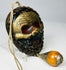 Vintage Tibetan guardian mask amulet with aged surface finish
