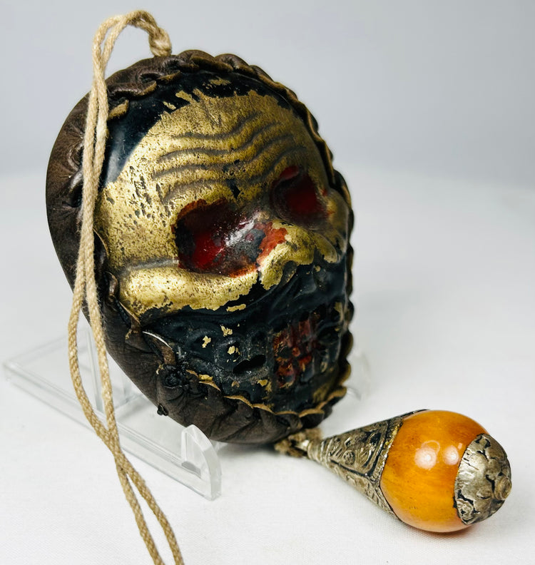 Vintage Tibetan guardian mask amulet with aged surface finish