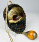 Vintage Tibetan guardian mask amulet with aged surface finish