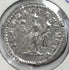 Reverse of a Roman silver denarius of Septimius Severus with standing figure, surrounding legend and preserved silver surface.