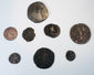 Alternate view of ancient and medieval coins displaying worn legends, portrait types, figures and naturally aged surfaces.