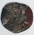 Close-up of an ancient Kingdom of Elymais coin with stylized royal imagery, crescent symbol and dark aged patina.