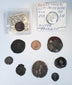 Ten ancient and medieval coins displayed with the Septimius Severus and Ferdinando I identification holders.