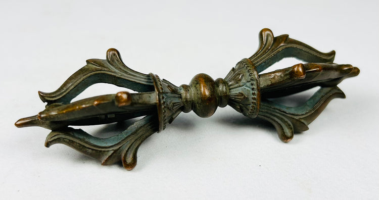 Pair of Tibetan Buddhist ritual objects in cast bronze