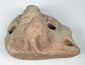 Pre-Columbian stone trigonolith associated with the Taíno zemí tradition of Puerto Rico or Hispaniola.