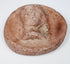 Hellenistic terracotta female head relief with elaborate coiffure, possible diadem, and classical facial features.