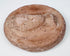 Ancient Eastern Mediterranean terracotta medallion with female bust in high relief and weathered surface.