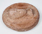 Ancient Eastern Mediterranean terracotta medallion with female bust in high relief and weathered surface.