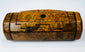 British 19th-century wooden snuff box with figured walnut grain, hinged top, and small circular dark inset.