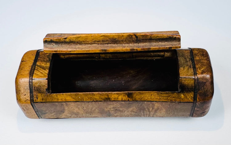 English pocket snuff box with richly figured burr wood, ebony-style stringing, and elongated single compartment.