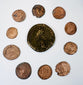 Ten Late Roman bronze coins arranged around a large central imperial coin, showing varied flan sizes, wear, and historic patination.