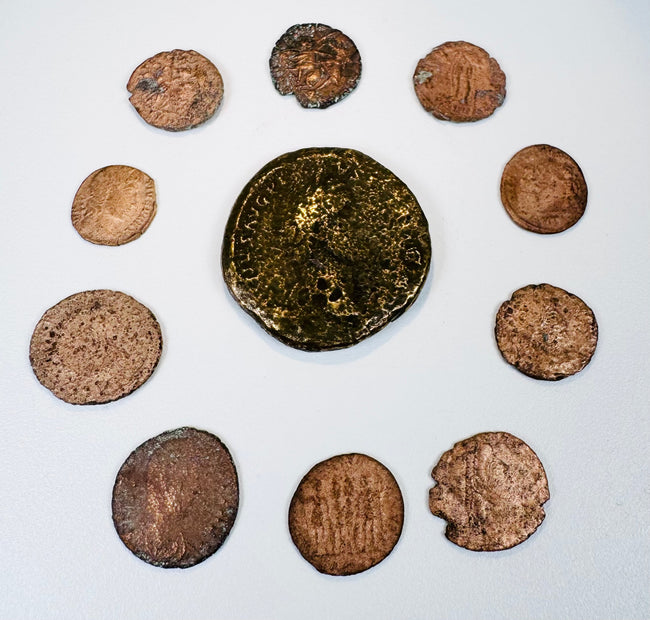 Ancient Roman Imperial coin collection with one large bronze coin and nine smaller Late Roman issues displaying portraits and reverse designs.