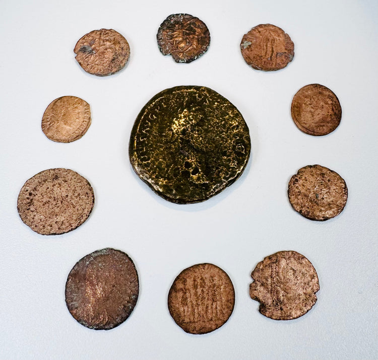 Ancient Roman Imperial coin collection with one large bronze coin and nine smaller Late Roman issues displaying portraits and reverse designs.