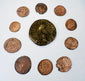 Ancient Roman Imperial coin collection with one large bronze coin and nine smaller Late Roman issues displaying portraits and reverse designs.