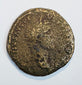 Large ancient Roman bronze coin with worn right-facing imperial portrait, partial Latin inscription, and dark olive-brown patina.