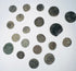 Mixed group of Roman Imperial and possible early Byzantine copper-alloy coins with worn portraits, inscriptions, and mineral encrustation.