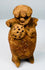Rear view of Pre-Columbian Maya terracotta figural rattle showing headdress and firing aperture