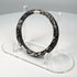 Ancient Roman burial glass bangle with naturally flaked surface revealing darker glass beneath