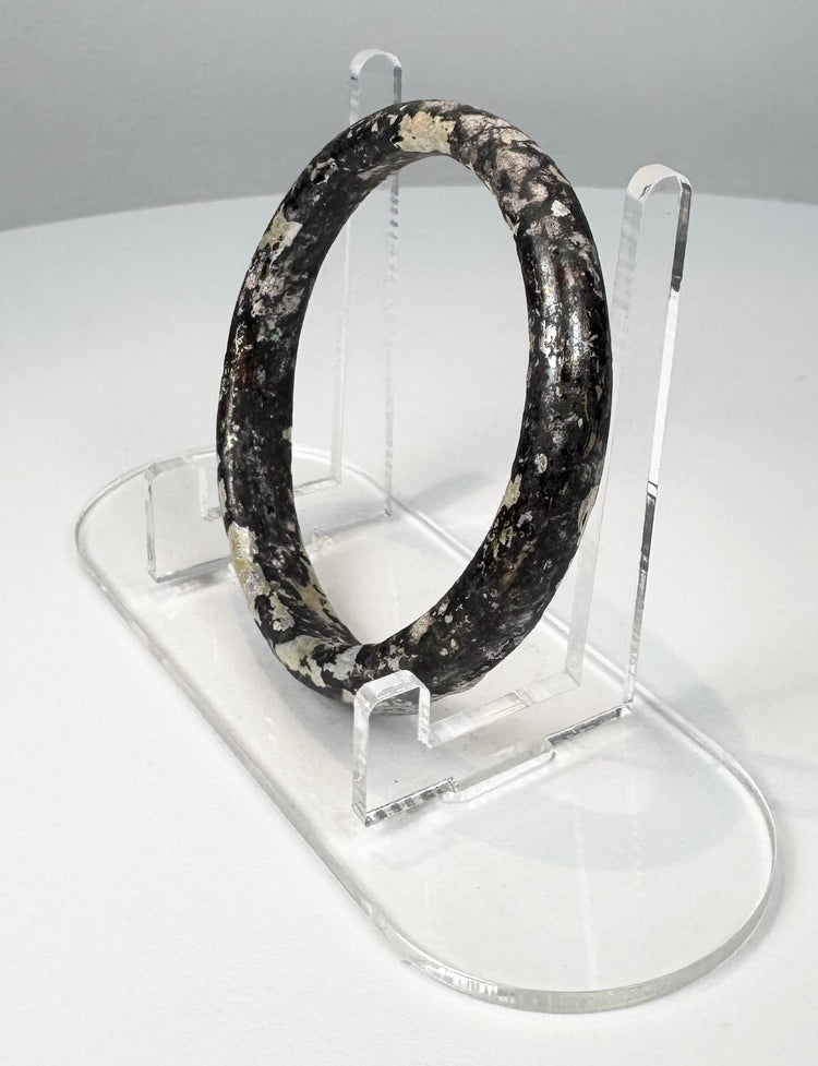 Roman glass bracelet with complete circular form and extensive cream, grey, and silver weathering