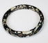 Archaeological Roman glass bracelet with heavy mineralization and rainbow-like iridescence