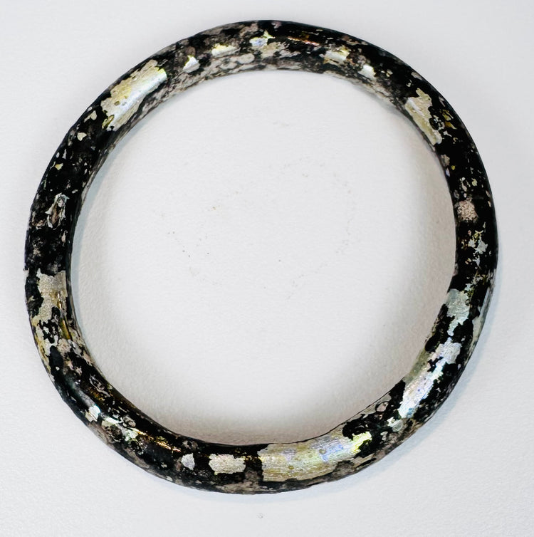 Roman Imperial Period glass bangle with silver-white mineral deposits and archaeological patina