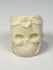 Memento mori-inspired camel bone ring with sculptural skull and foliate decoration