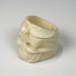 Camel bone memento mori ring with skull, floral detail, and thick carved band