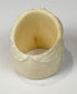 Hand-finished camel bone skull ring with pale cream coloration and carved floral details