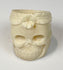 Sculptural skull ring in carved camel bone with deep eye sockets and incised teeth
