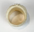 Detailed camel bone skull ring with carved leaves, flower, cheekbones, and teeth