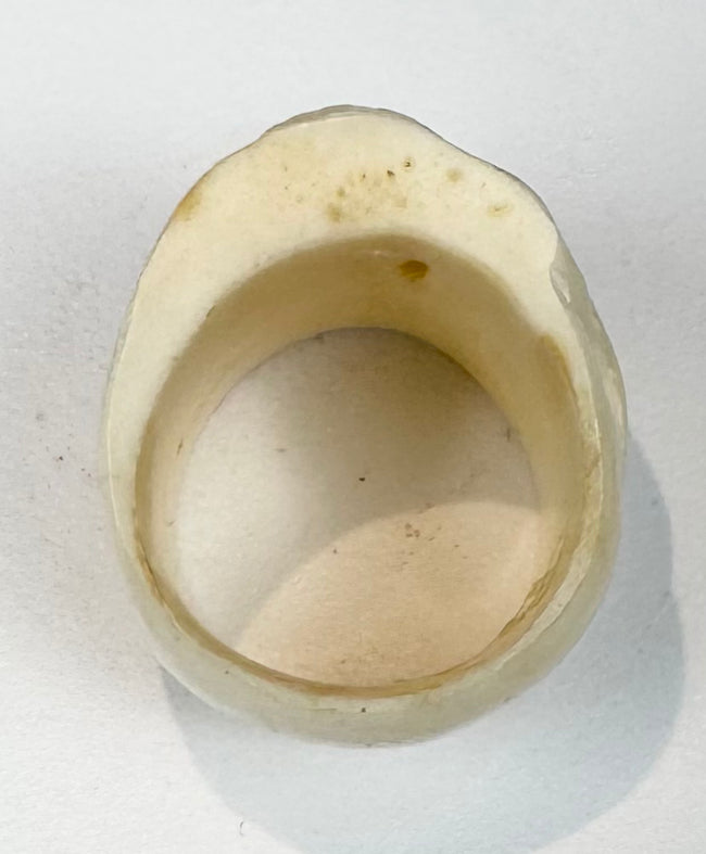 Vintage carved bone ring with human skull design and botanical ornament