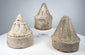 Eastern Indian clay votive stupas with ribbed spires and layered architectural ornament
