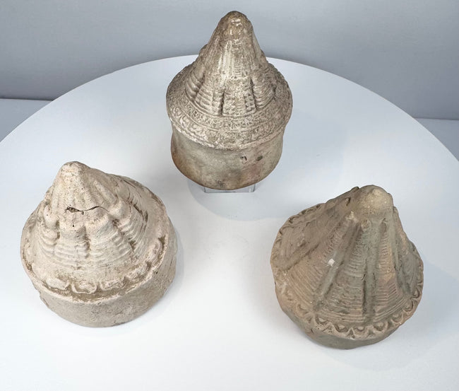Early medieval Buddhist terracotta stupas showing three distinct moulded architectural designs
