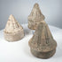 Ancient Buddhist devotional stupas with cylindrical bases and detailed moulded superstructures