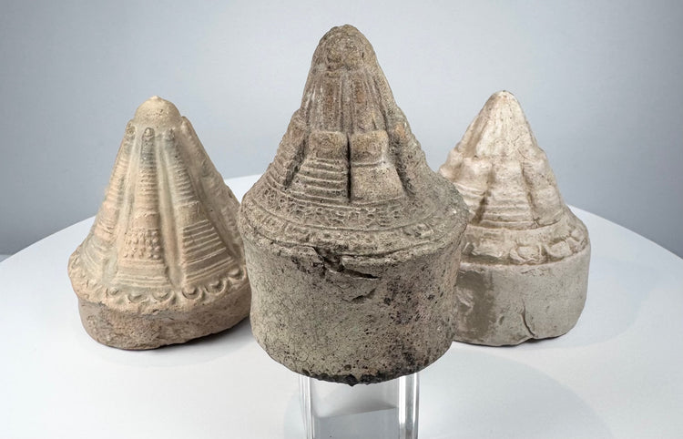 Ancient Indian votive stupas with moulded lotus-petal decoration and weathered archaeological surfaces