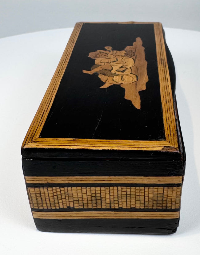 End view of Anglo-Indian black lacquered box showing layered wood borders and mosaic decoration