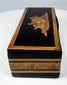 End view of Anglo-Indian black lacquered box showing layered wood borders and mosaic decoration