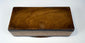 Underside of Anglo-Indian marquetry box showing natural wood base and antique construction