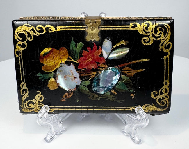 Antique Victorian calling card case with colorful floral decoration, mother-of-pearl inlay, and brass clasp