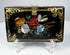 Antique Victorian calling card case with colorful floral decoration, mother-of-pearl inlay, and brass clasp