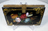 Black lacquer Victorian calling card case with floral ornament, gilt scrolling border, and central brass clasp