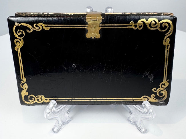 Victorian lacquered calling card case displaying mother-of-pearl floral ornament and decorative edge detailing