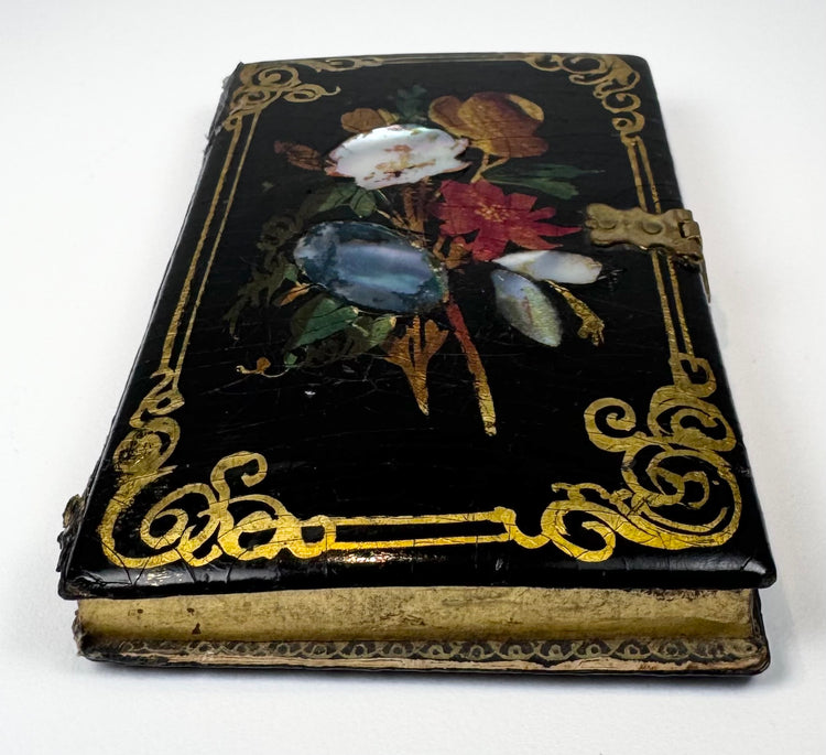Victorian calling card case with mother-of-pearl floral decoration arranged across glossy black lacquer