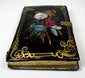 Victorian calling card case with mother-of-pearl floral decoration arranged across glossy black lacquer